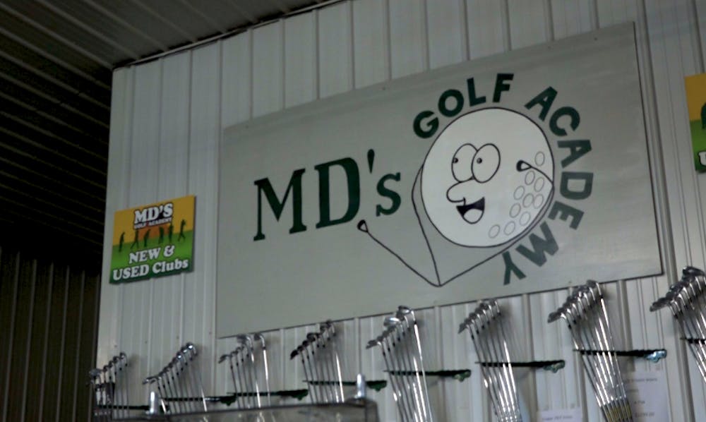 A sign located inside MD’s Golf Academy’s facility. 
