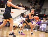 Delta senior Cooper Bratton looks to pass to a teammate Dec. 21 against Muncie Central at the Muncie Central Fieldhouse. The Eagles defeated the Bearcats 49-46. Zach Carter, DN.