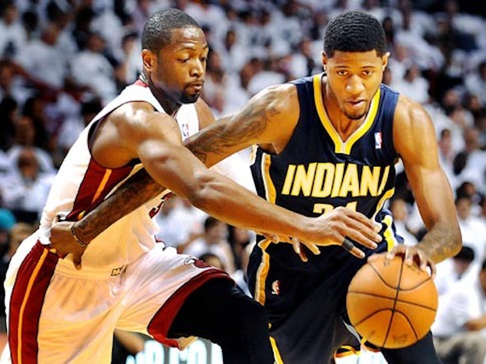 The Miami Heat's Dwyane Wade, left, looks to strip the ball away from the Indiana Pacers' Paul George in the first half during Game 2 of the Eastern Conference Semifinals at American Airlines Arena in Miami, Fla., on May 15, 2012. Tuesday night George scored 34 points and recorded nine rebounds in an 80-76 win over the Chicago Bulls.  MCT PHOTO
