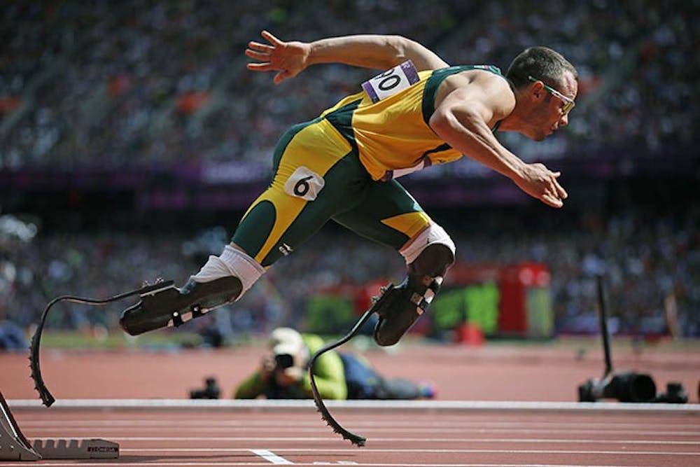 Oscar Pistorius, a double leg amputee Olympic runner from South Africa, warms up at the Olympic stadium, August 3, 2012, in London. On Thursday, February 14, 2014, South African police arrested Pistorius and said he would be charged with murder after his girlfriend, Reeva Steenkamp, was shot and killed at his home earlier in the morning. (Brian Peterson/Minneapolis Star Tribune/MCT)