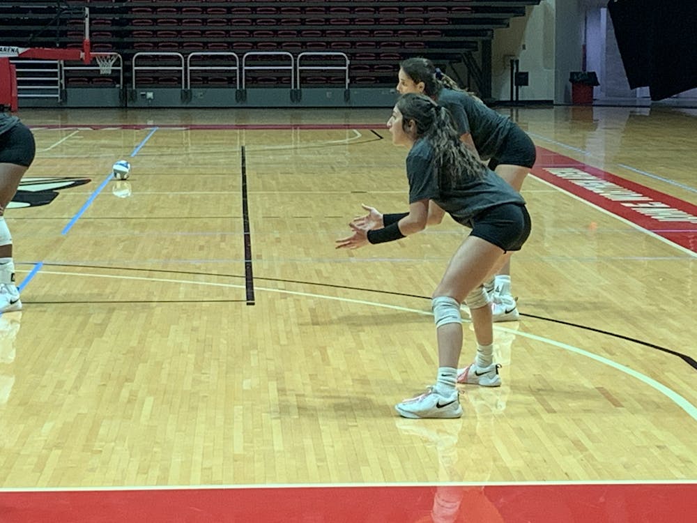 Kate Avila prepares to receive the serve at practice on Oct. 29. Avila reached 2,000 career digs this past weekend and hopes to continue to add to the total.