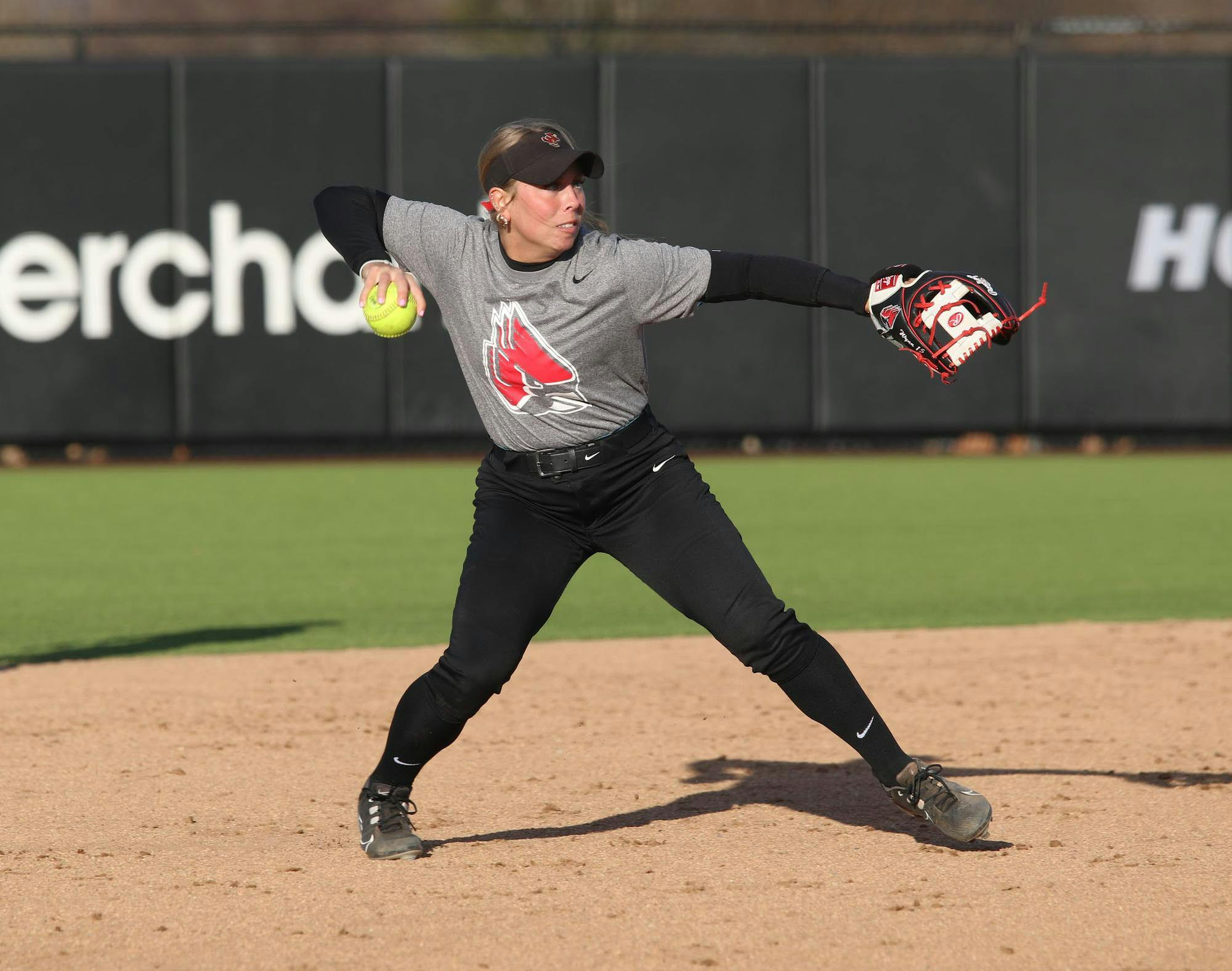 Graduate student infielder Haley Wynn throws Feb. 13 during a practice at the softball field at the First Merchants Ballpark Complex. Zach Carter, DN.