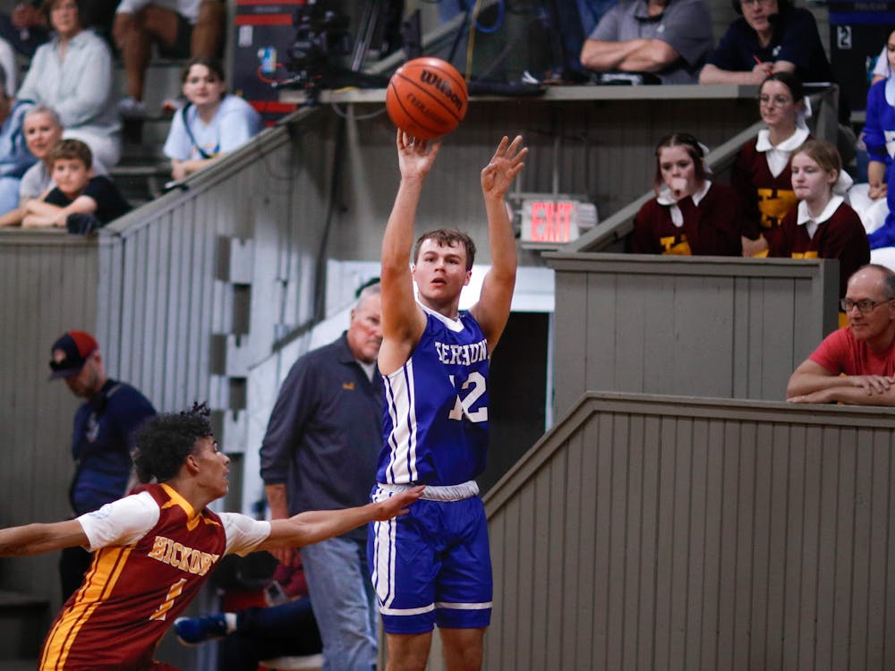 Wapahani senior Isaac Andrews shoots 3-point-shot during the Hoosier Reunion All-Star Classic April 27 at Hoosier Gym. Andrews always dreamed of playing in the famed Hoosier Gym in Knightstown. Andrew Berger, DN