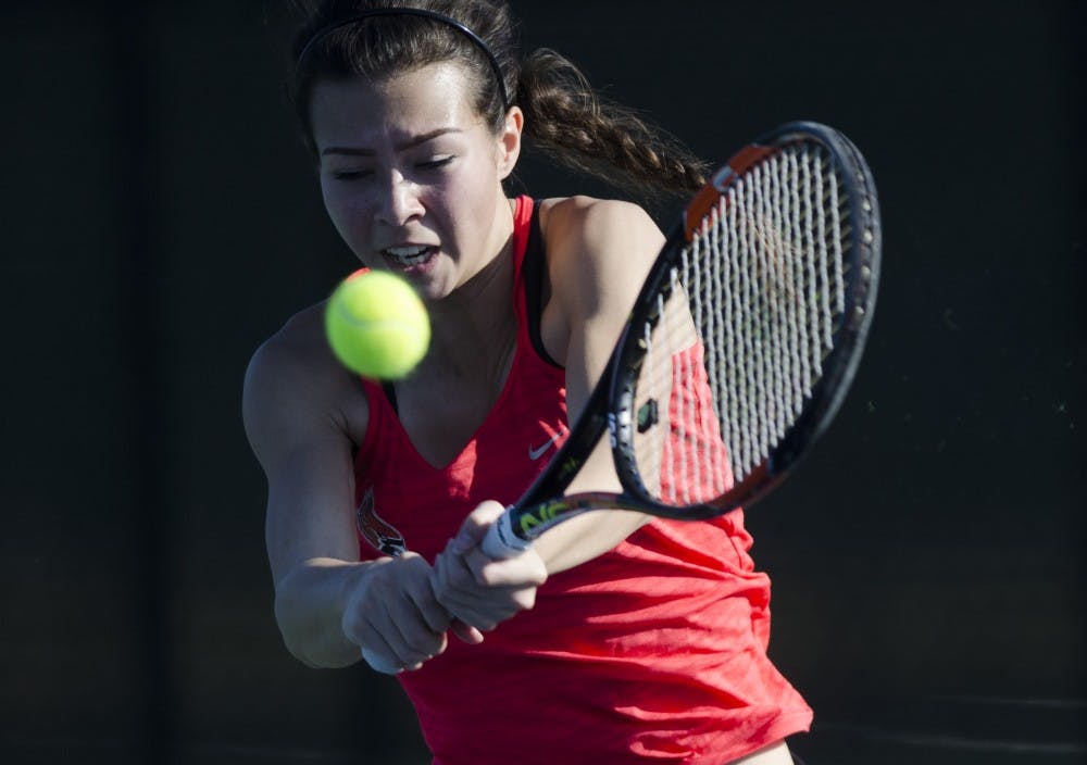 Sophomore Audrey Berger hits a backhand during her match against IUPUI on Feb. 19. Emma Rogers // DN
