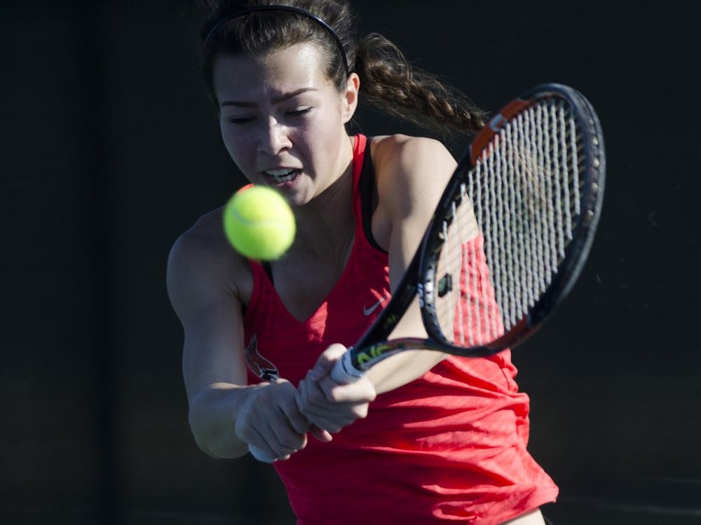 Sophomore Audrey Berger hits a backhand during her match against IUPUI on Feb. 19. Emma Rogers // DN