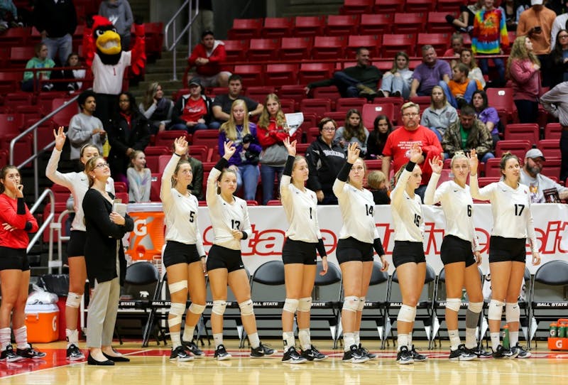 The Ball State women's volleyball team chirp on the sidelines before a set point against Toledo on Nov. 2, 2017 at John E. Worthen Arena. Elliott DeRose, DN