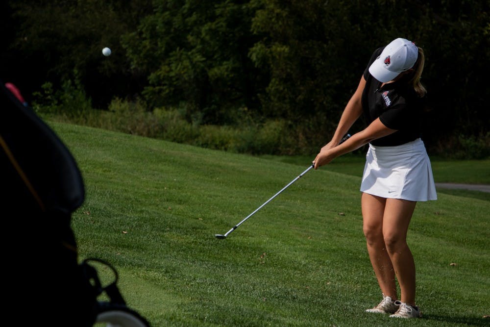 Sophomore Dylann Armstrong pitches her ball up onto the green Sept. 16, 2019, at the Players Club at Woodland Trails in Yorktown, Ind. Armstrong’s third round of the tournament was her best ending nine over par. Eric Pritchett, DN