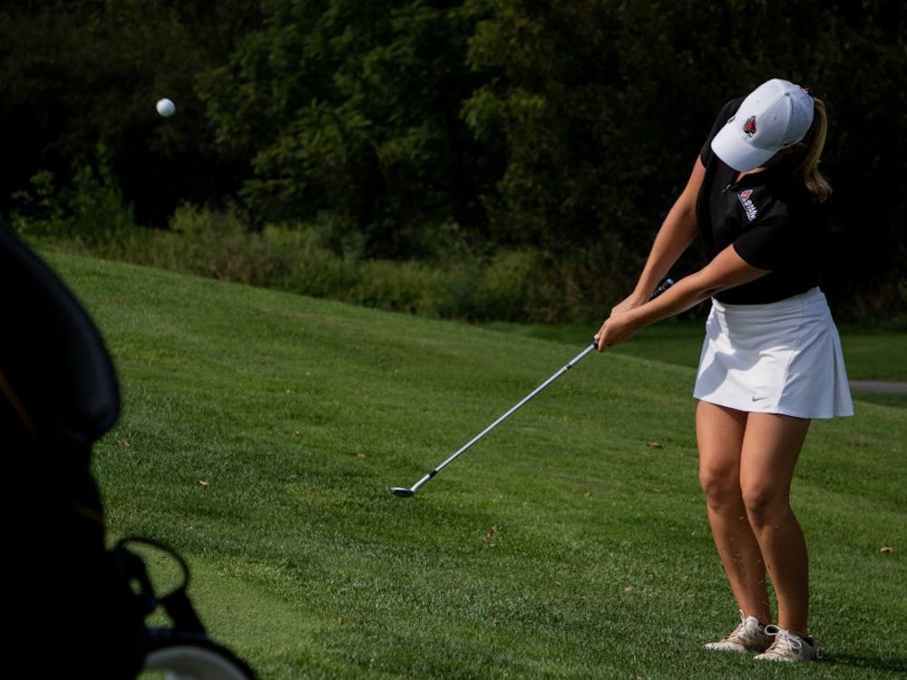 Sophomore Dylann Armstrong pitches her ball up onto the green Sept. 16, 2019, at the Players Club at Woodland Trails in Yorktown, Ind. Armstrong’s third round of the tournament was her best ending nine over par. Eric Pritchett, DN