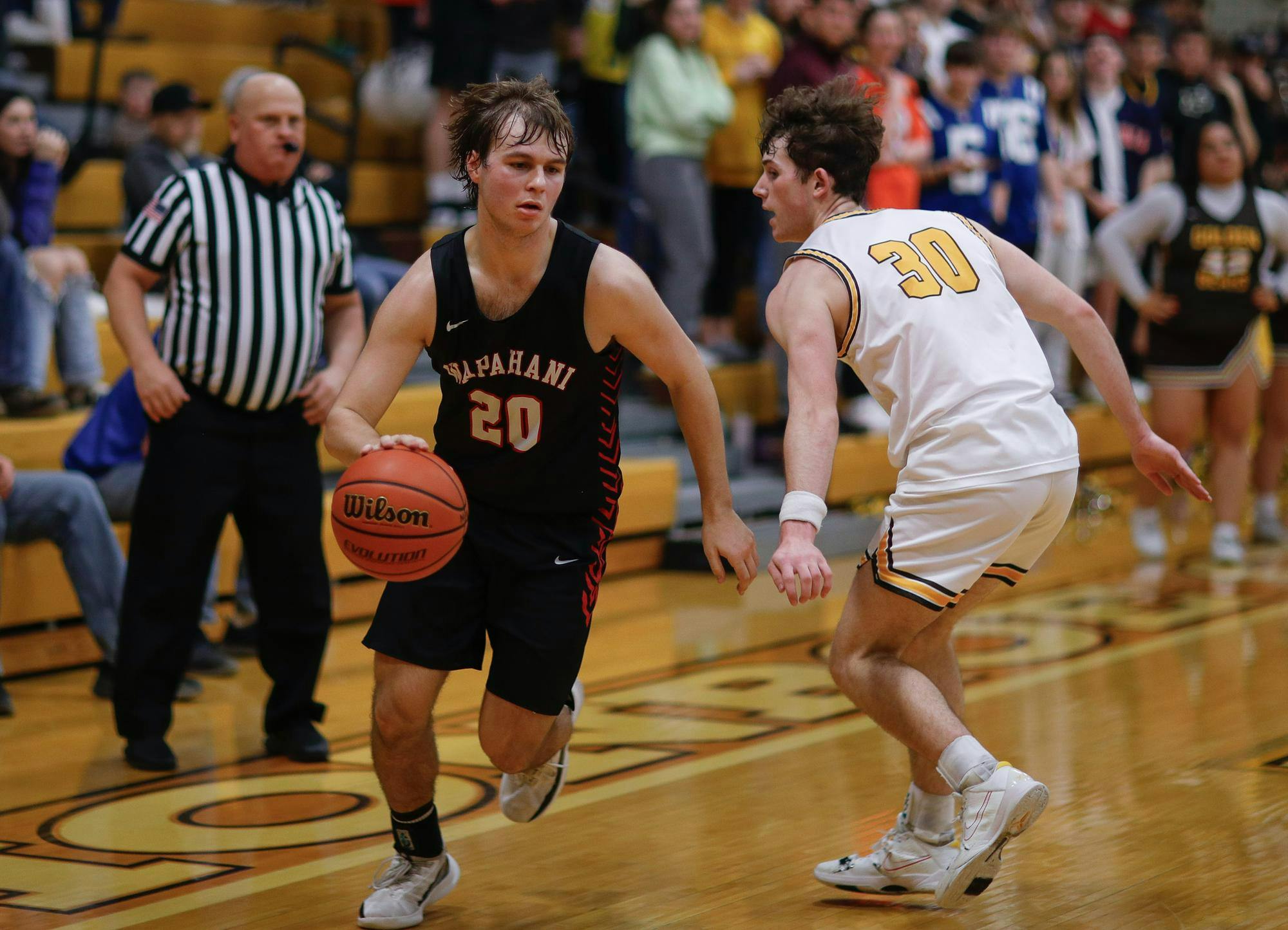 Senior Isaac Andrews possesses the ball against Monroe Central Feb. 9 at Monroe Central High School. Andrew Berger, DN 