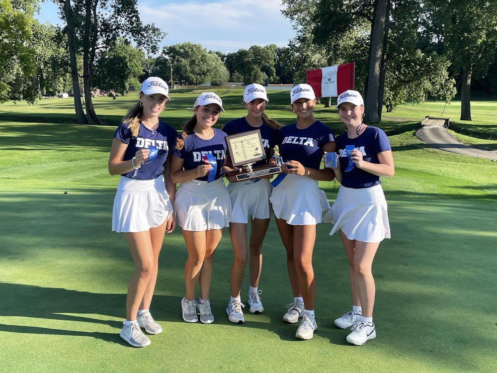 The Delta girls golf team poses with their Delaware County Championship trophy August 12 at the Muncie Elks Golf Course. Zach Carter, DN. 