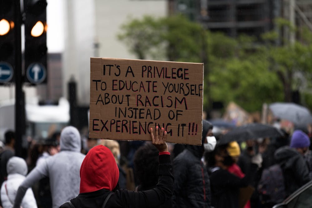 A peaceful protestor holds a sign in support of the notion to remain educated on issues of racial injustice. As student journalists at The Daily News, we take our responsibility to report informative and educational stories on topics of relevance in our society today. Unsplash, Photo Courtesy