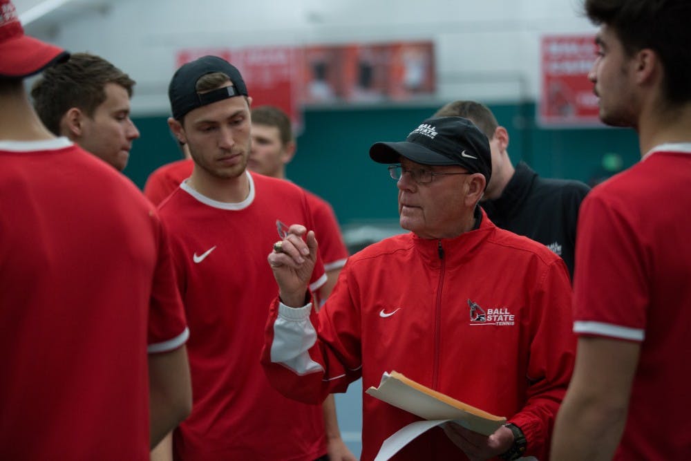 Head coach Bill Richards talks to his team to get them ready for the singles matches against the University of Toledo at the Northwest YMCA in Muncie on March 24. Ball State won 5-2. Eric Pritchett, DN