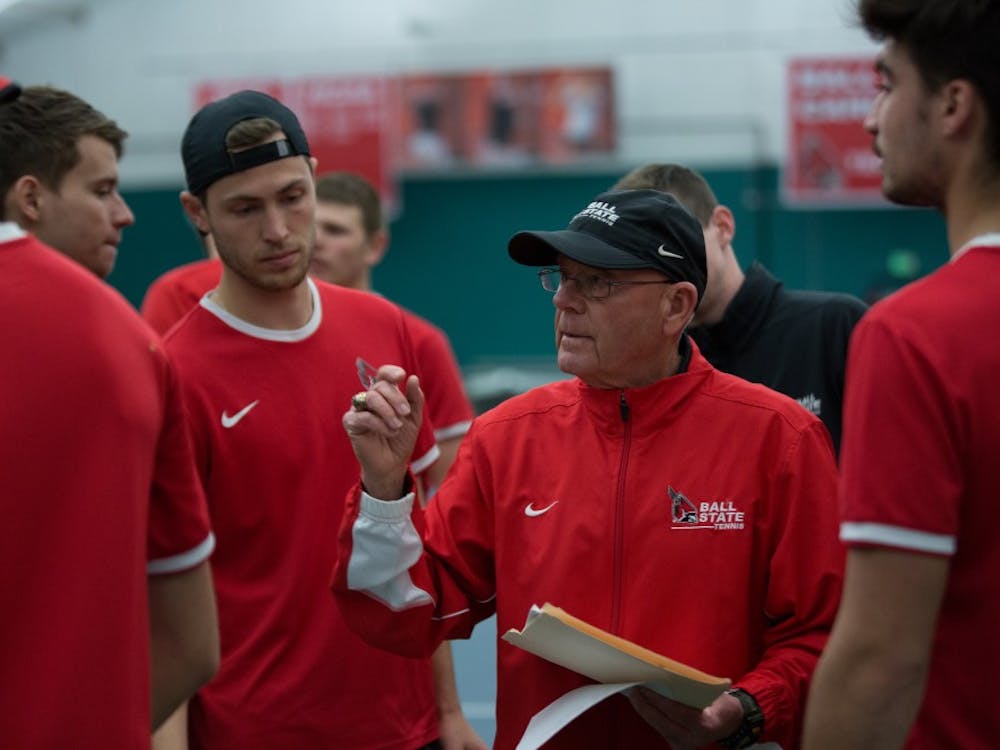 Head coach Bill Richards talks to his team to get them ready for the singles matches against the University of Toledo at the Northwest YMCA in Muncie on March 24. Ball State won 5-2. Eric Pritchett, DN