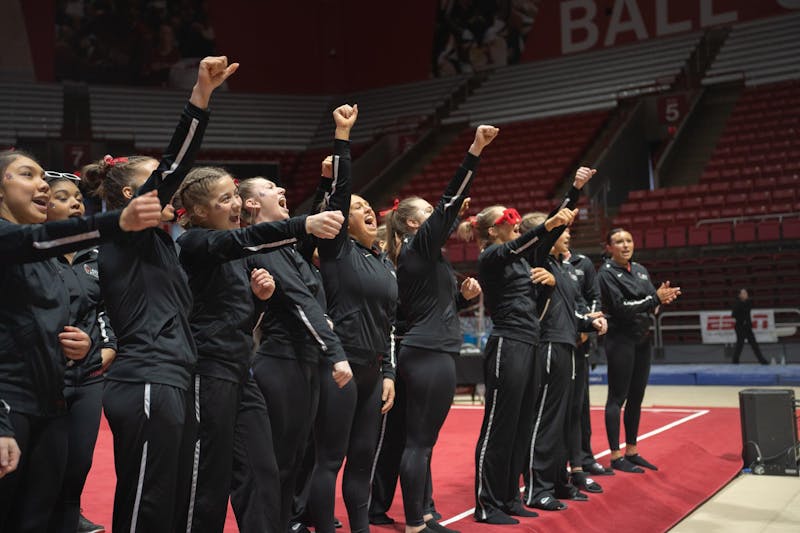 Ball State Women's Gymnastics cheers in unifrom at the end of the compeititon against Kent State Feb. 4 at Worthen Arena. The Cardinals won 196.075 vs 195.525. Kate Tilbury, DN