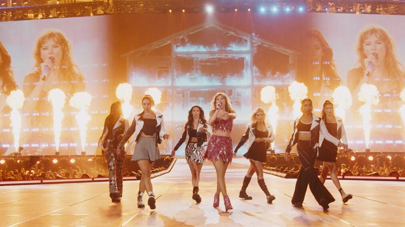 Taylor Swift performing at the Eras Tour with image provided by Disney.