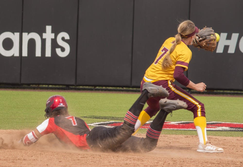 <p>Ball State sophomore Kennedy Wynn, left, slides into second base while Central Michigan's Rachel Vieira catches the ball during the first game against the Chippewas April 21 at the softball field at First Merchant’s Ballpark Complex. Ball State won the first game 2-1. <strong>Briana Hale, DN</strong></p>