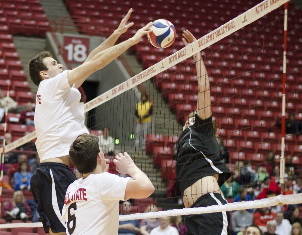 Senior middle attacker Matt Leske tips the ball over the net in the second set against Belmont Abbey on March 7 at Worthen Arena. 