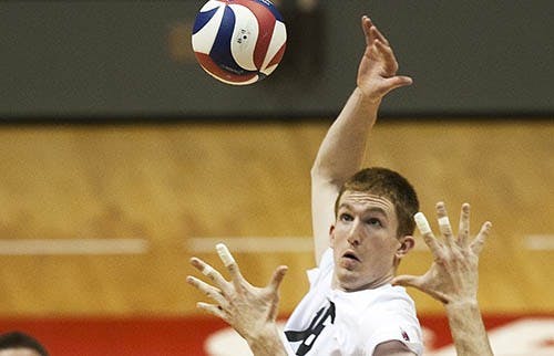 Junioir Kevin Owens gets the assist from Graham McIlvaine doing the match against Penn State. DN PHOTO JORDAN HUFFER