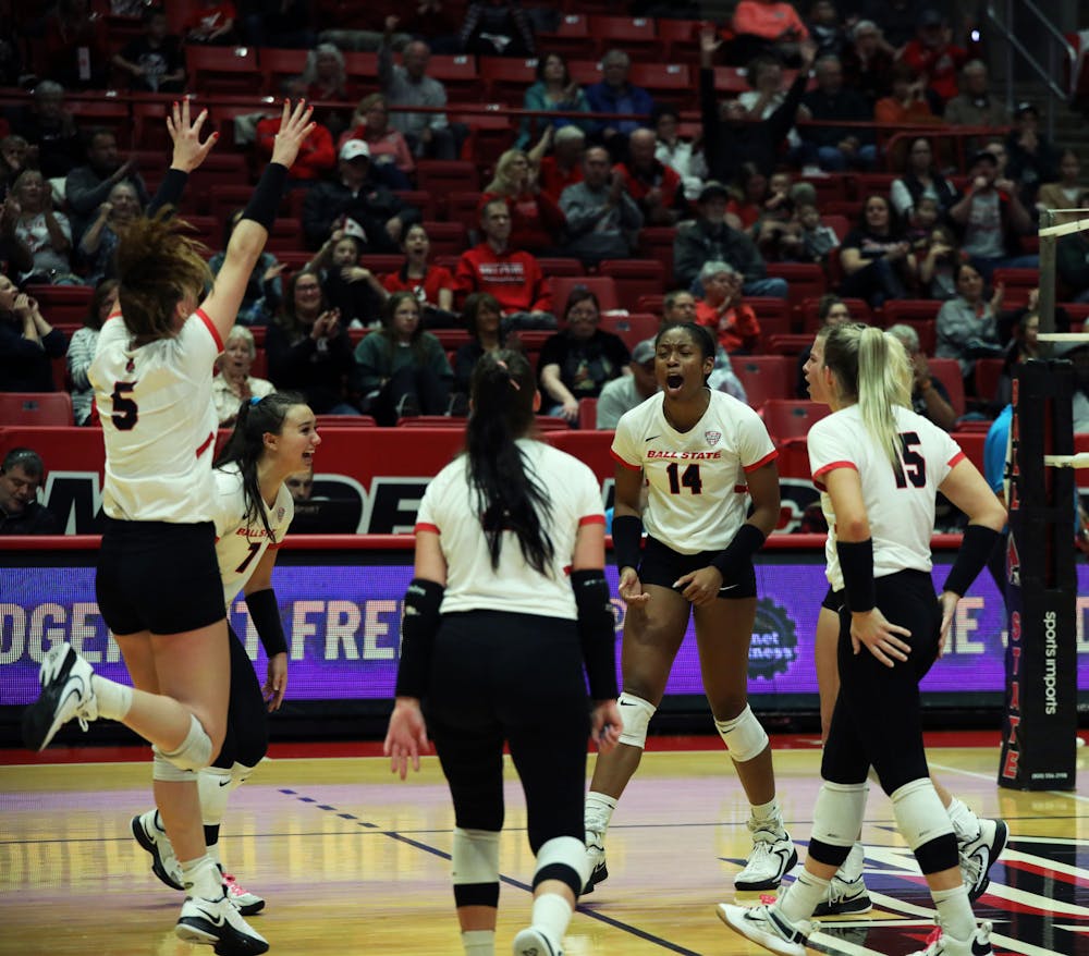 Ball State women's volleyball celebrates scoring a point against Ohio Oct. 28 at Worthen Arena. The Cardinals won 3-1 against the Bobcats. Mya Cataline, DN