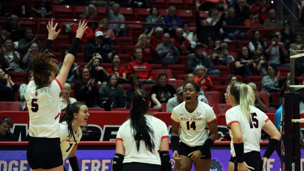 Ball State women's volleyball celebrates scoring a point against Ohio Oct. 28 at Worthen Arena. The Cardinals won 3-1 against the Bobcats. Mya Cataline, DN