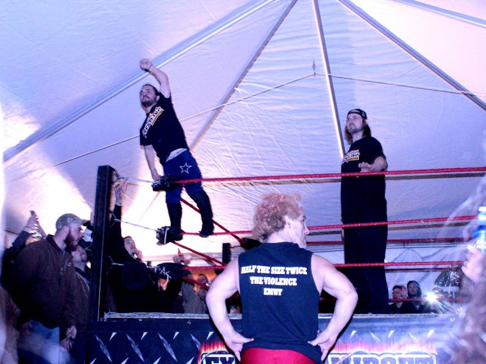 Members of the Extreme Midget Wrestling Federation entertain onlookers at Muncie Gras 2015. The federation has traveled across the world, appearing in Europe, South America and Japan.  DN PHOTO RACHAEL BERRY