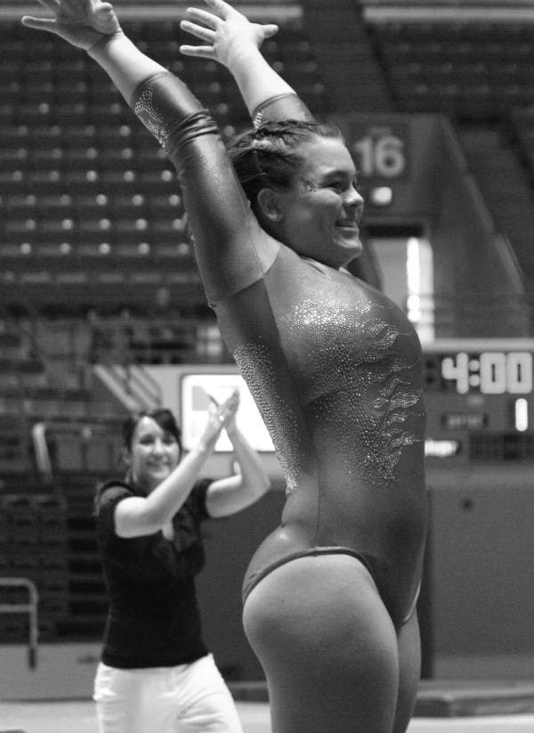 Brittney Emmons makes her landing during a meet against Central Michigan last season.DN PHOTO  SAM HOUSEHOLDER