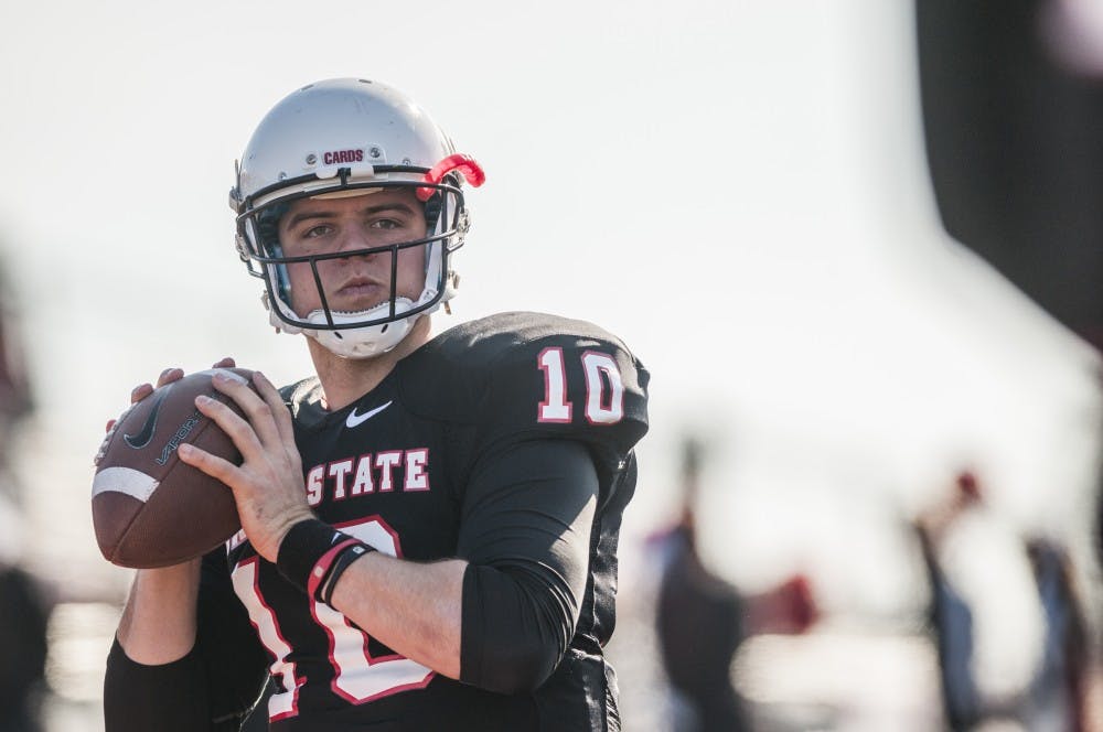 Senior quarterback Keith Wenning practices on the sidelines. DN PHOTO JONATHAN MIKSANEK