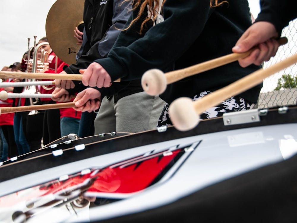 The Pride of Mid-America performs during downtime inbetween races at the annual Homecoming event, Bed Race Oct. 19, 2018, on Ball State's campus. The band performed the fight song to raise the audience and competitors' spirit. Madeline Grosh,DN