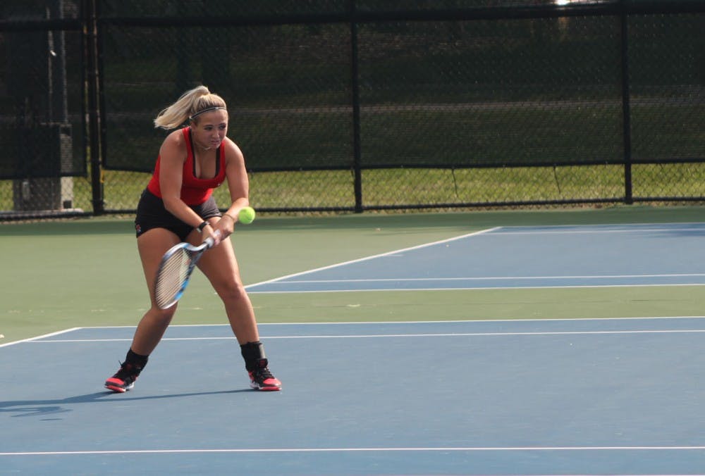Senior Peyton Gollhofer attempts to return the ball back to her Detroit Mercy opponent in her singles match. Peyton enters this fall season with a singles overall record of 45-26. Patrick Murphy,DN