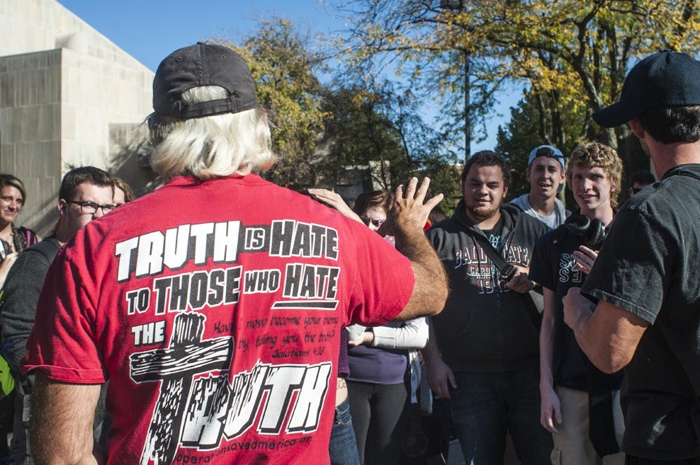  Tony Coupee gestures to a student during an anti-abortion protest Oct. 9 in front of Bracken Library. Missionaries to the Preborn’s protest moved due to confusion over the rules concerning campus protest. DN FILE PHOTO JONATHAN MIKSANEK