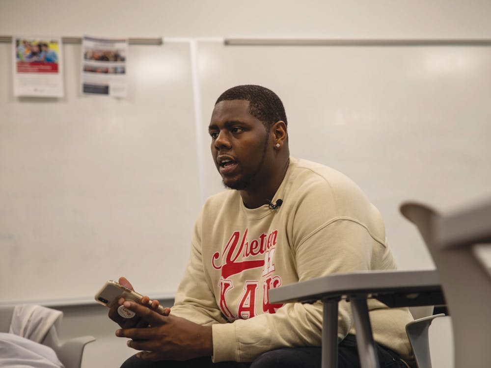Senior business administration major, Sultan "Mufasa" Benson, gets interviewed by NewsLink Indiana Jan. 22. 2020, in a Whitinger Business Building classroom. Benson's Marketing 310 professor, Shaheen Borna, called the police on him after he refused to change seats because he was charging his laptop. Jaden Whiteman, DN