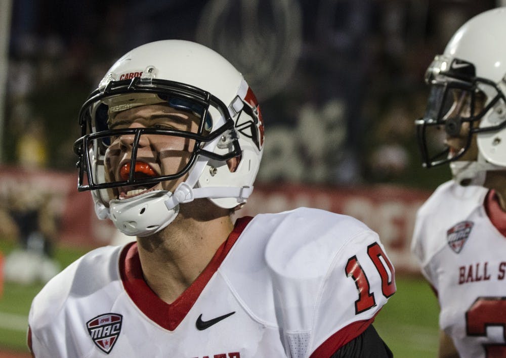 Former quarterback Keith Wenning celebrates after throwing a touchdown pass to Willie Snead in the game against Illinois State on Aug. 29, 2013, at Scheumann Stadium. Wenning will be at Stoops Automotive to greet fans July 11. DN FILE PHOTO BREANNA DAUGHERTY 