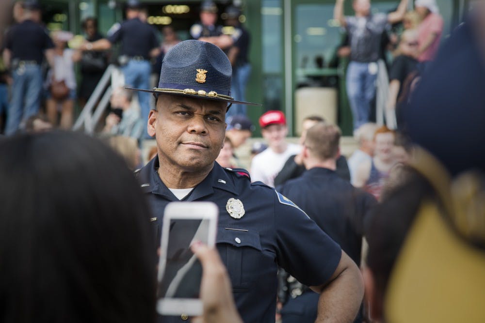 Police line the street in front of the Elements Financial Blue Ribbon Pavilion, separating large crowds of protestors and supporters. DN PHOTO/TRENT SCROGGINS