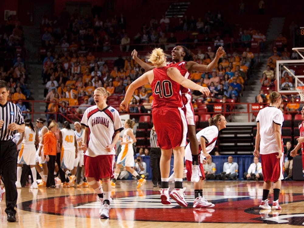 Amber Crago celebrates with a teammate after No. 12 Ball State upset No. 5 Tennessee in the first round of the 2009 NCAA Division I Women's Basketball Tournament on Mar. 22, 2009 at E.A. Diddle Arena. Ball State Photo Services, Photo Provided