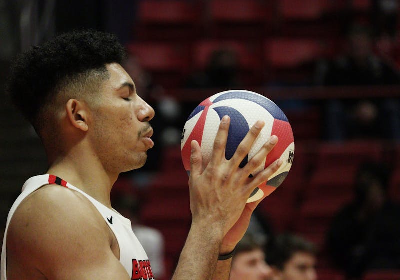 Senior middle blocker Felix Egharevba prepares to serve the ball at a volleyball game against Purdue Fort Wayne Feb. 17 at Worthen Arena. Egharevba had four blocks during the game. Jamie Howell, DN