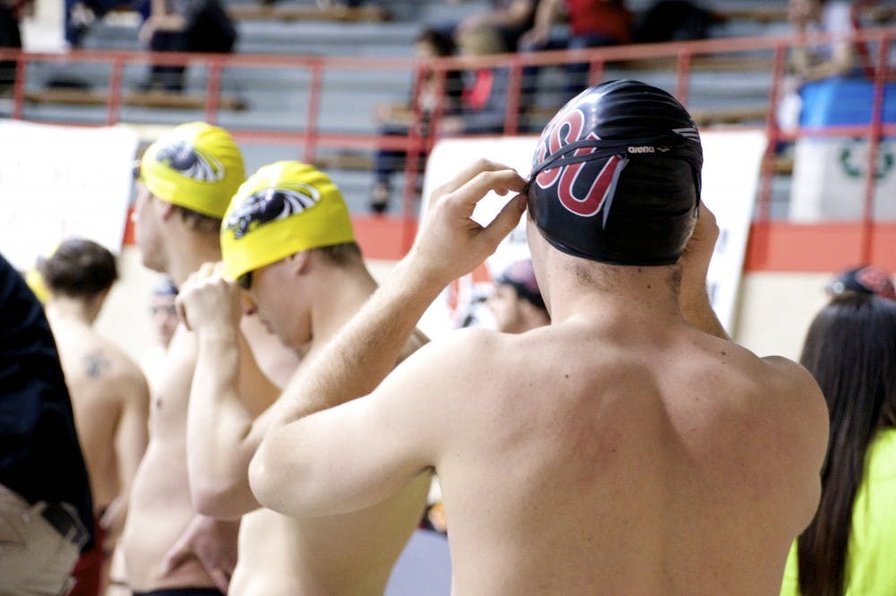 <p>Freshman Zach Toman prepares to swim in the medley relay&nbsp;during the swim and dive meet against IUPUI and the University of Milwaukee on Jan. 23, 2015 at Lewellen Pool. DN PHOTO ALAINA JAYE HALSEY</p>