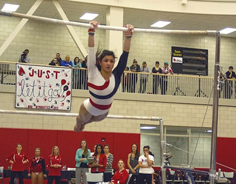 Sophomore Samantha Santos performs on the uneven bars Jan. 18 in Irving Gym. Santos scored a 9.800 on beam this Friday when the Cardinals competed in a double header against Penn and Cententary College. DN FILE PHOTO EMMA FLYNN