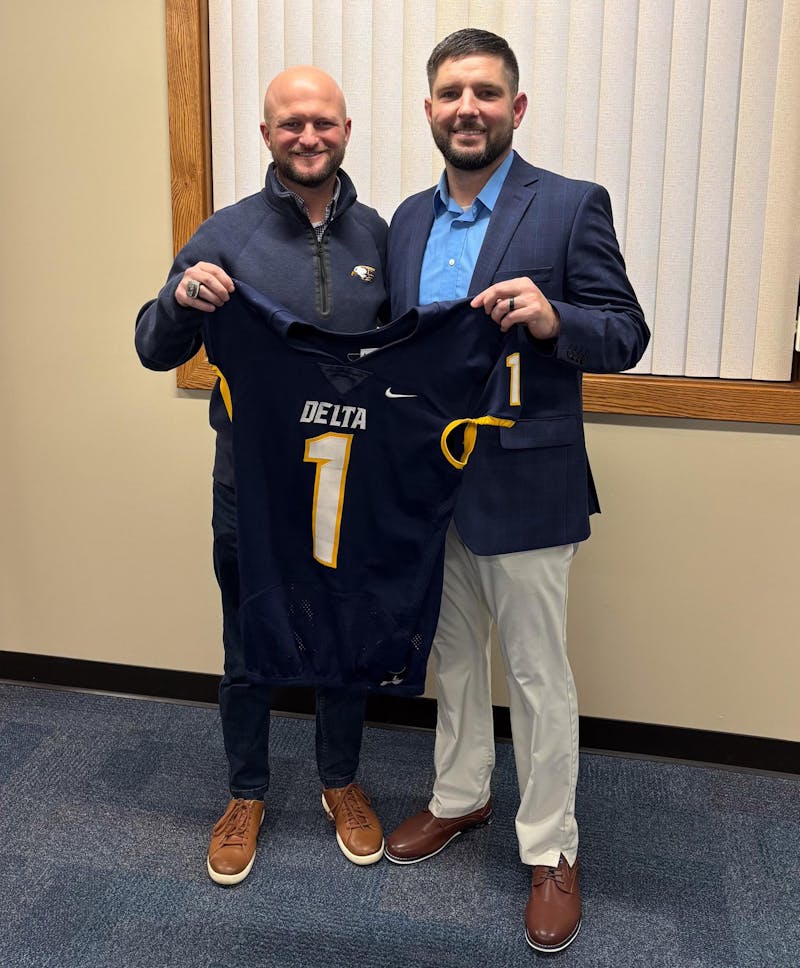 Newly hired Delta head football coach Jeremy Lochner stands with Delta athletic director Tilmon Clark Jan. 6 at Delta High School. Delta Athletics, photo provided. 