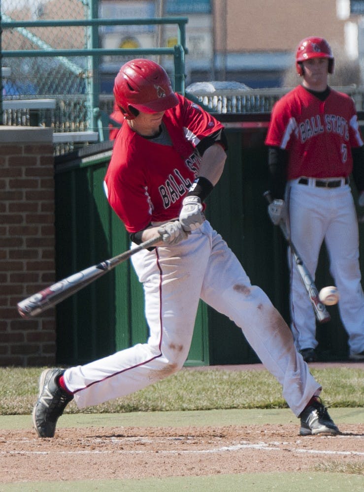 Junior Sean Godfrey swings at an Akron pitch during the second game of the Akron doubleheader on Mar. 23, 2013. Ball State defeated USC Upstate 7-4. DN FILE PHOTO JONATHAN MIKSANEK
