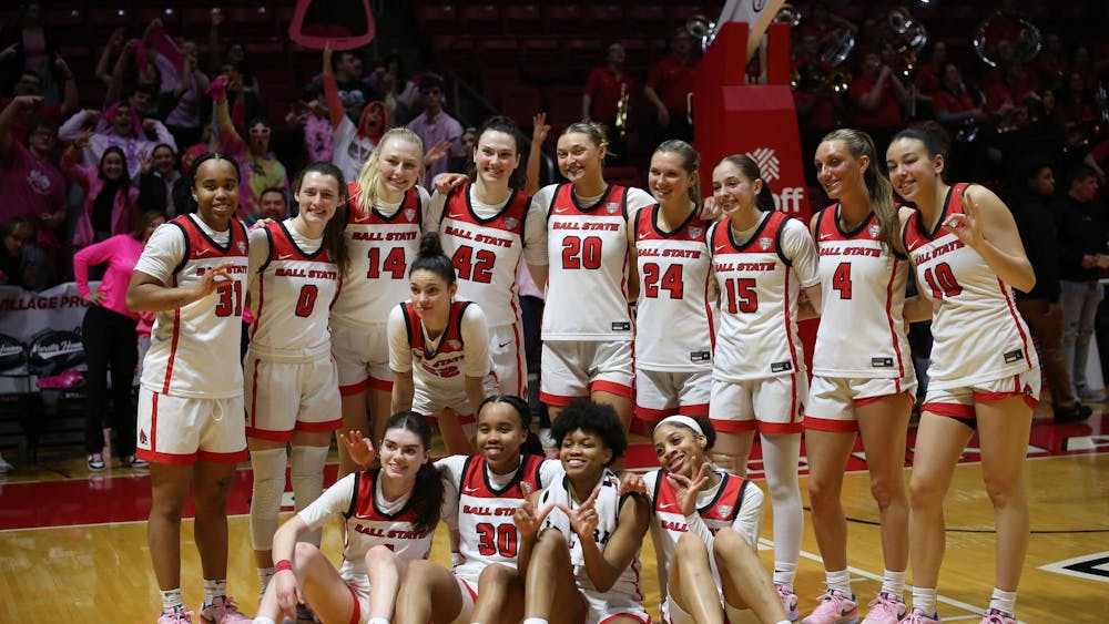 The women's basketball team poses for a picture on the court after the game against Central Michigan on Feb. 21 at Worthen Arena. The team scored 78 points in total. Paola Fernandez Jimenez, DN