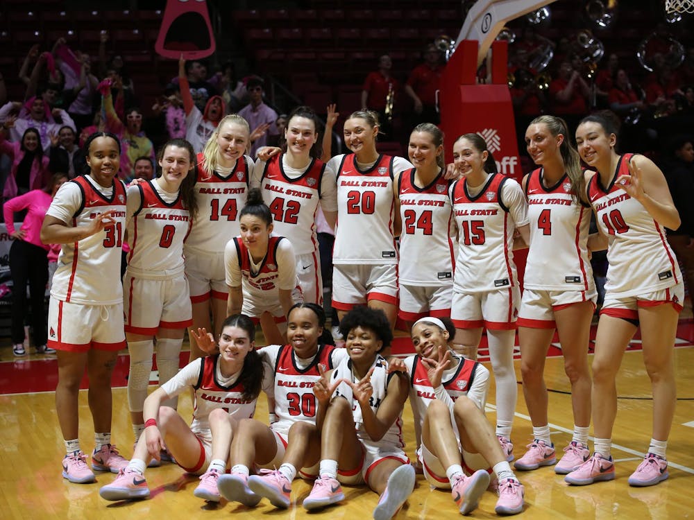 The women's basketball team poses for a picture on the court after the game against Central Michigan on Feb. 21 at Worthen Arena. The team scored 78 points in total. Paola Fernandez Jimenez, DN