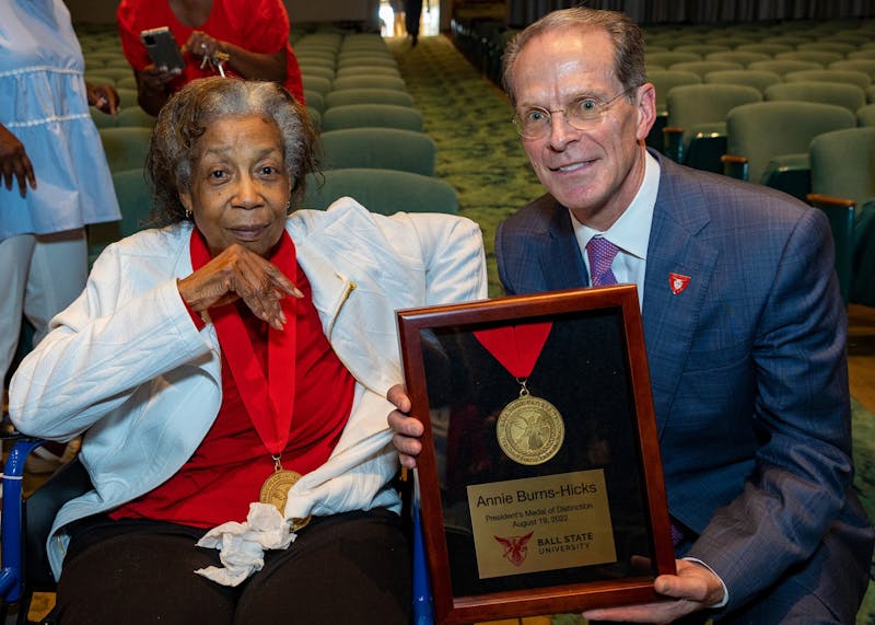 Ball State President Geoff Mearns presents Ball State alumna Annie Burns-Hicks with the President's Medal of Distinction in John R. Emens College-Community Auditorium August 19, 2022. Burns-Hicks was the first black teacher in Hammond, Indiana's school district. 