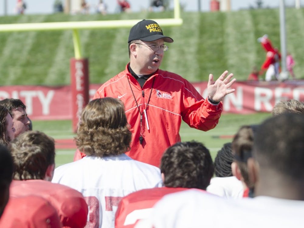 Head coach Pete Lembo talks to the football team after the spring game on April 19 at Scheumann Stadium. DN PHOTO BREANNA DAUGHERTY 