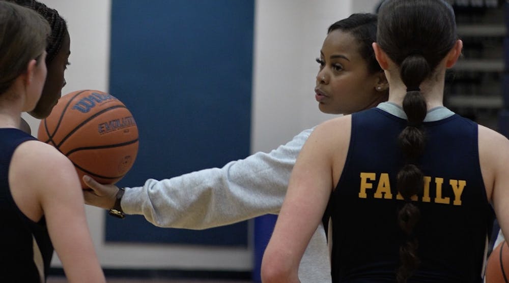 Head Coach Tyronda Benning in a huddle with the Delta Eagles.
