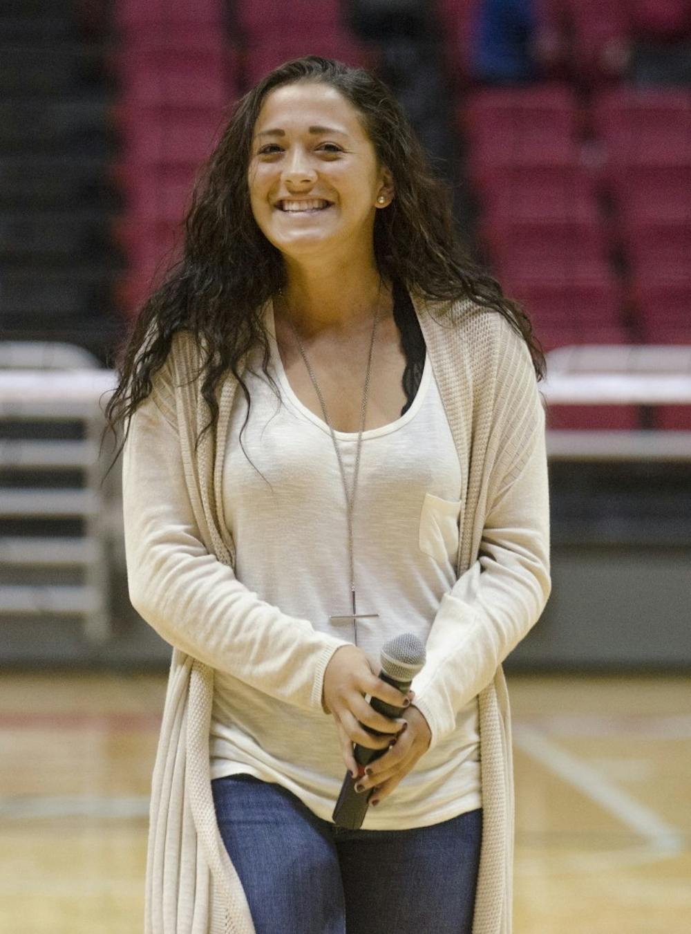 <p><strong>Lauren Hall</strong>, a sophomore midfielder for the Ball State soccer team, smiles after singing the National Anthem before the Women's Volleyball game on Oct. 5 at Worthen Arena. Hall sang in last year's Talent Search. <em>DN PHOTO BREANNA DAUGHERTY</em></p>