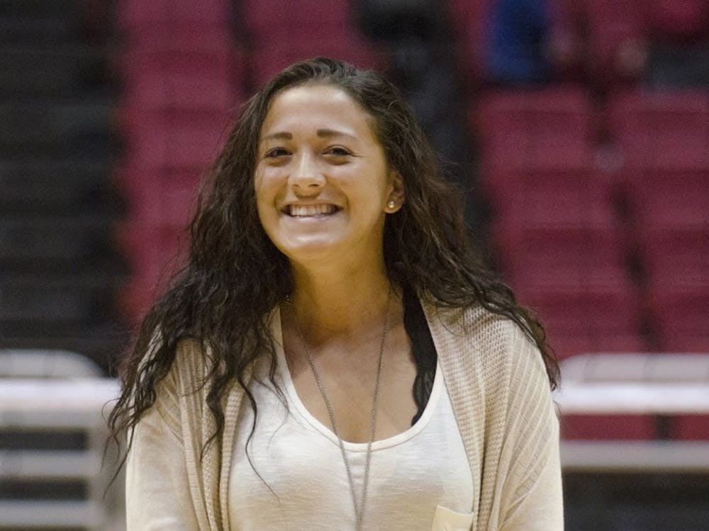 Lauren Hall, a sophomore midfielder for the Ball State soccer team, smiles after singing the National Anthem before the Women's Volleyball game on Oct. 5 at Worthen Arena. Hall sang in last year's Talent Search. DN PHOTO BREANNA DAUGHERTY