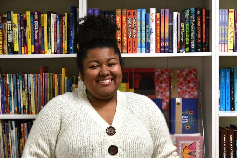 Keeley Malone, owner and creator of Ink Drinkers Anonymous, poses in her store Oct. 23 in Muncie, Ind. Owning a bookstore has been a lifelong dream for Malone who opened her store in 2022.  Ella Howell, DN