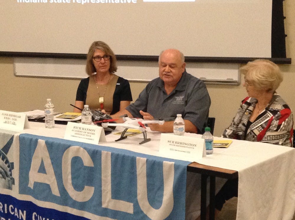 Jane Henegar, executive director of American Civil Liberties Union of Indiana; Rich Hanson, a government and regulatory affairs representative for the Academy of Model Aeronautics; and State Rep. Sue Errington talk during the panel discussion June 4 at the Innovation Connector. The panel discussion was part of the First Wednesdays Discussions Series. DN PHOTO ALAN HOVORKA