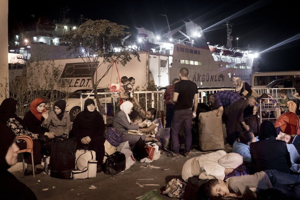 Syrian refugees at the port of Tripoli, Lebanon, waiting to board the ferry Lady Su, which travels to Tasucu, Turkey, in a twelve-hour journey. The ferry, which was scheduled to depart at 10 p.m. on September 21, left the port at 10 a.m. the following day due to regular delays and an truck accident during loading. (Gaia Squarci/McClatchy/TNS)
