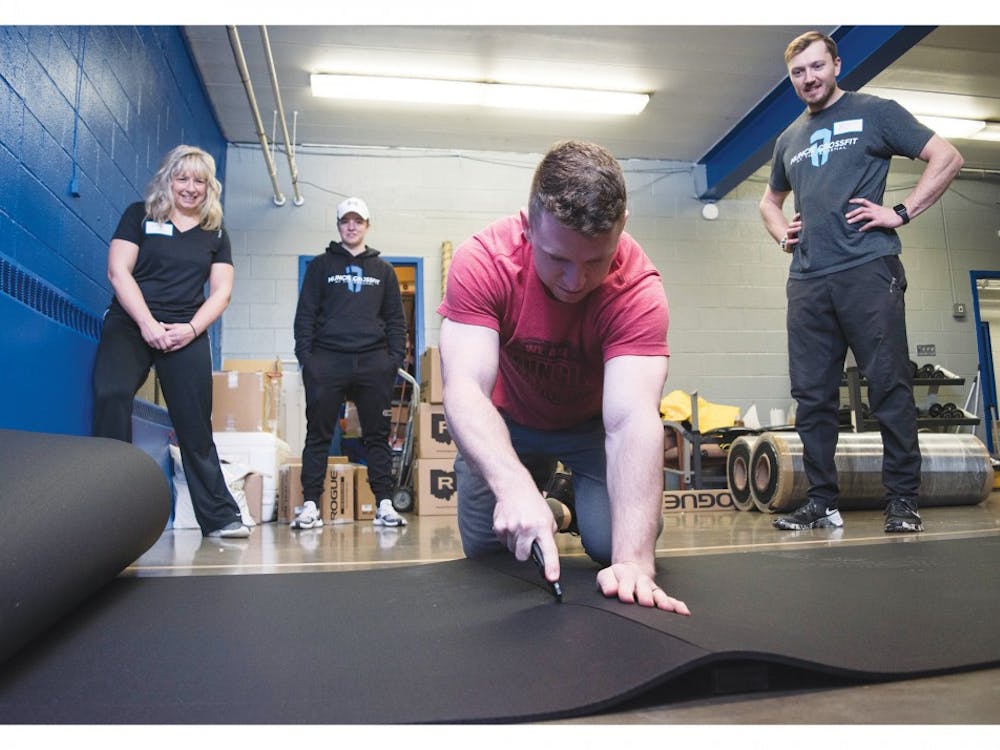Volunteers from Muncie Crossfit reconstruct the gym room at the Boys & Girls Clubs of Muncie (BGC), Jan. 17, 2019, with new equipment and new matting. The BGC of Muncie has raised more than $56,500 of their $85,000 goal. Stephanie Amador, DN 